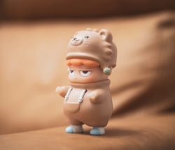 A blind box toy figurine, POH Bear by Vin, a vinyl collectible. Preorder - Ships Late May 2024.