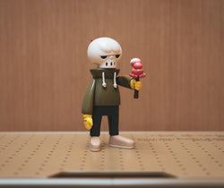 A LEGO figurine holding an ice cream, part of KUHAKU ORIGINAL Ver. by JD Wang - Preorder. From Strangecat Toys, a blind box and art toy store.