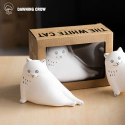 Preorder THE WHITE CAT vinyl figurine by Dawning Crow, 11.5cm. Group of white cat figurines in a box. Captures the essence of Strangecat Toys.