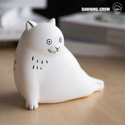 A vinyl figurine of a white cat by Dawning Crow, available for preorder at Strangecat Toys. 11.5cm.