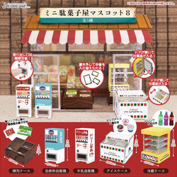 A blind box toy store showcasing Mini Candy Shop Mascot 8 Gacha. Features a vending machine, toy store awning, and Chinese sign. Preorder now for Q3 2024.