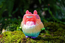 A resin toy animal in the grass, titled MONSTER MALLOW - Rainbow Fluffy by MUPA, limited to 80 pieces and measuring 10 cm.