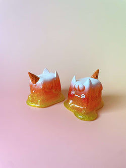 Too Hot! Ice Cream Cat by Rato Kim, featuring two orange and white cat-shaped resin toys with artificial fur, designed to resemble ice cream cones.