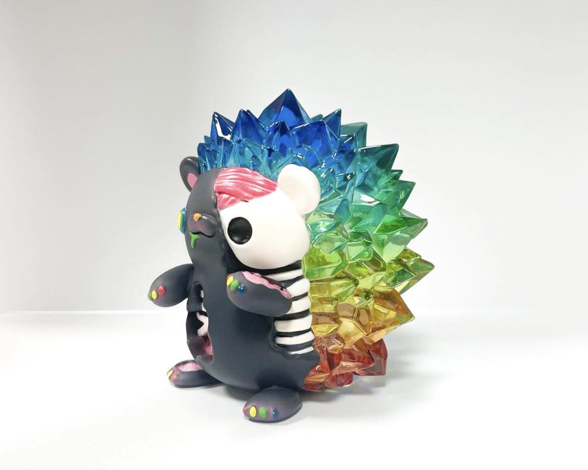 Zombie Hogkey - Black Rainbow Ver. by Tangent, a 10cm Japanese Sofubi toy, features a hedgehog covered in colorful crystals. Limited to 10 pieces.