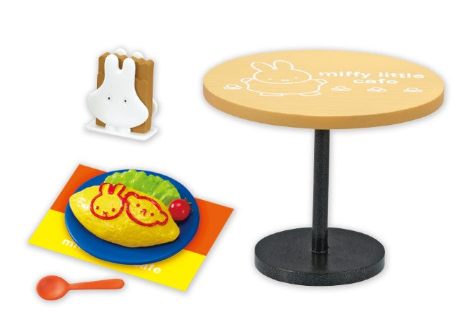 Miffy little cafe Re-ment Blind Box Series displayed on a round table, featuring a yellow object with red animal designs, part of an 8-design collection.