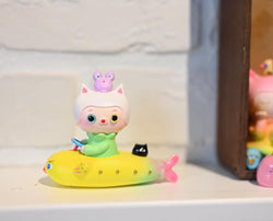 Cat boat by Hua Hua, a toy animal on a boat with a close-up of a toy on top.