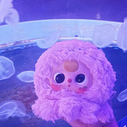 Baby Three Romantic Ocean Plush from the blind box series, featuring a pink stuffed animal held in a hand, part of Strangecat Toys' unique collection.