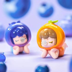 Baby Nanci Fruit Blind Box Series figurines, featuring toy designs of children and fruits, part of a collectible set with secret variations.