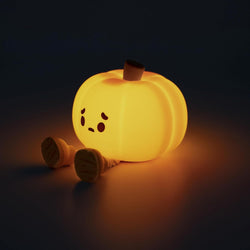 Emo Pumpkin Night Light: Silicone night light resembling a lit pumpkin with legs and a face. Includes charging cable and manual. Perfect for 9.5 hours on high or 34 hours on low setting.