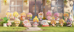 A blind box series featuring RiCO Happy Room Tour figurines on grass, including dolls, toys, and a plant in a pot. Get 5 regular designs, 5 alternate, 4 surprise, and 2 secret designs.