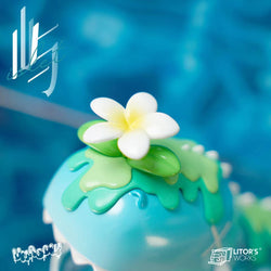 Resin toy with flower on top, 8 cm high and 17 cm long, from Umasou! Island.