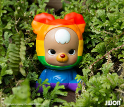 Jrbo Rainbow Edition by JWON, a 10cm resin toy bear, nestled in bushes, available for preorder, ships July 2024.