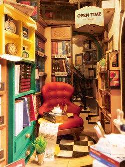 Book Nook Kits For Adults - Bookstore miniature set with red chair, bookshelves, and plant. Includes detailed instructions and requires 2 AAA batteries. Ideal for creative minds. Dimensions: 9.1 x 12.2 x 1.8 in.