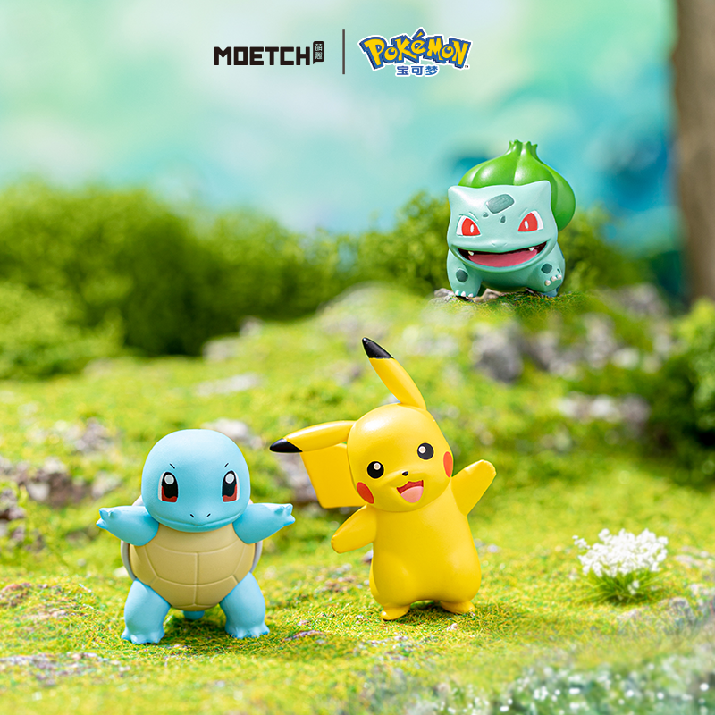 Pokémon Series Moetch Bean-Pikachu figures displayed on grass, featuring small, toy animals from a blind box collection at Strangecat Toys.