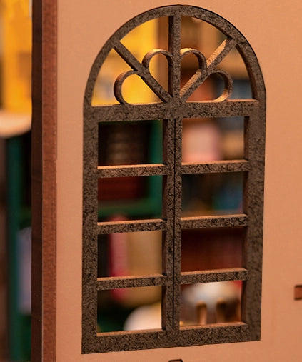 Close-up of a window-themed Book Nook Kit for adults from Strangecat Toys. DIY assembly with detailed instructions. Requires 2 AAA batteries. Dimensions: 9.1 x 12.2 x 1.8 in.