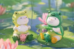 A blind box series featuring toy figurines of a girl, pink frog, and frog with a frisbee on lily pads. REPOLAR Wonderful Summer Trip Blind Box Series offers 9 regular designs, 4 Classical, and 1 secret design.