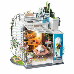 A blind box and art toy store presents Dora's Loft DIY Miniature House kit. Explore a colorful candy house with a spiral staircase and intricate details. Dimensions: 8.3 x 2.6 x 10.5 in.