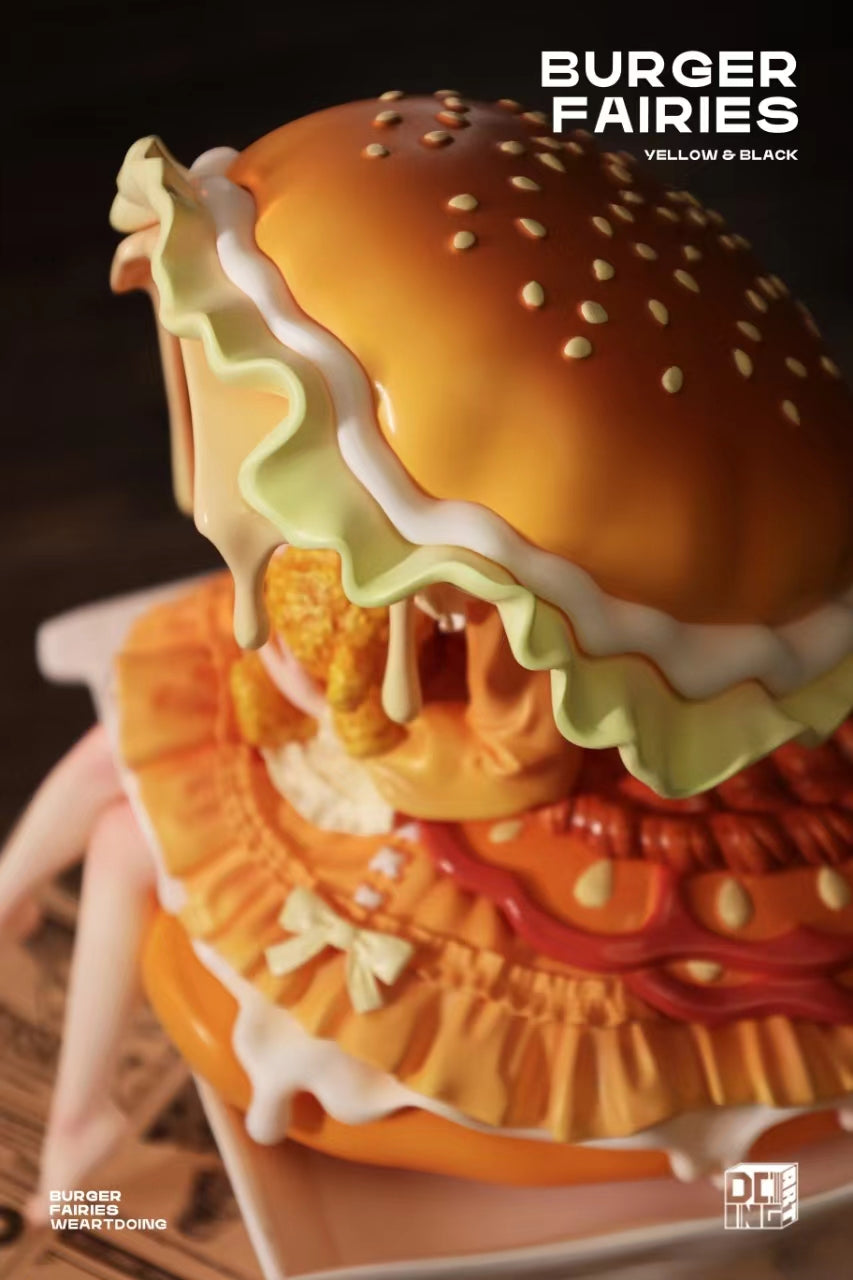 Close-up of The Sleeping Beauty-Burger Fairies-Yellow resin toy, limited edition, featuring a burger design.