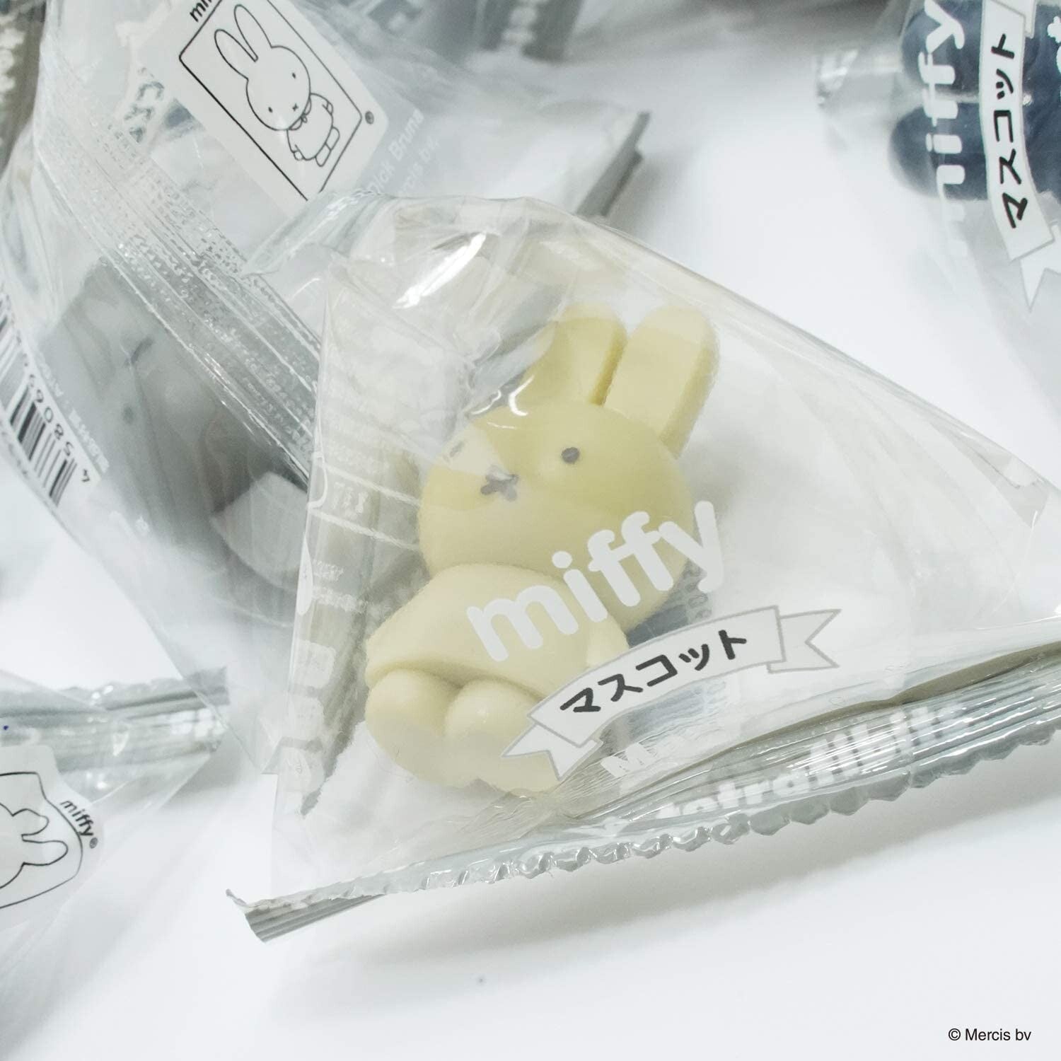 Alt text: A Miffy Mystery Bag Series product, featuring a white bunny in a plastic bag with candy. Part of a blind box set from Strangecat Toys.