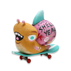 Toy snail riding a skateboard, part of The Exotic Shnail Expo collection by Jellykoe.