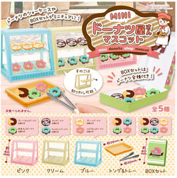 MINI donut shop mascot Gatcha Series - Preorder: Toy display of donuts, shelves, tongs, and chef cartoon.