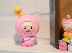 Resin figurine of The little pink fool by Hua Hua, hand painted toy with surprised face, close-up details, 7x6x11cm dimensions.