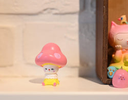 Hand-painted resin figurine of a small mushroom toy by Hua Hua, 4x6x5cm.