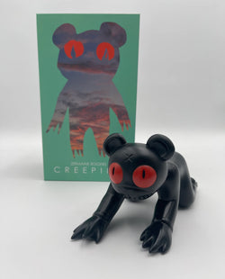 Vinyl toy of a black monster with red eyes, limited edition 8 Creeping Dero (Shadow Variant) by Jermaine Rogers.