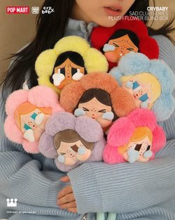A woman holding CRYBABY Sad Club Series-Plush Flower Blind Box Series stuffed dolls. Preorder for July 2024, includes 6 designs and 1 secret.