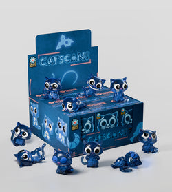 Catscans Blind Box featuring blue cat figurines, each design reveals glow-in-the-dark foods inside, capturing the playful essence of Strangecat Toys' art collection.