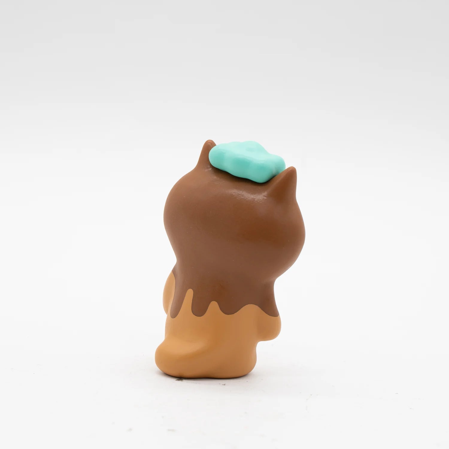 KIYO NEKO 'CHOCOLATE' EDITION toy animal figure with blue object, brown liquid, and soft vinyl material.