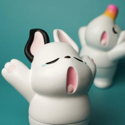 A Sofubi toy set featuring Nimbus and Elfie characters yawning, embodying the essence of spring anticipation. Packaged with a header card, each toy is approximately 12cm in size.