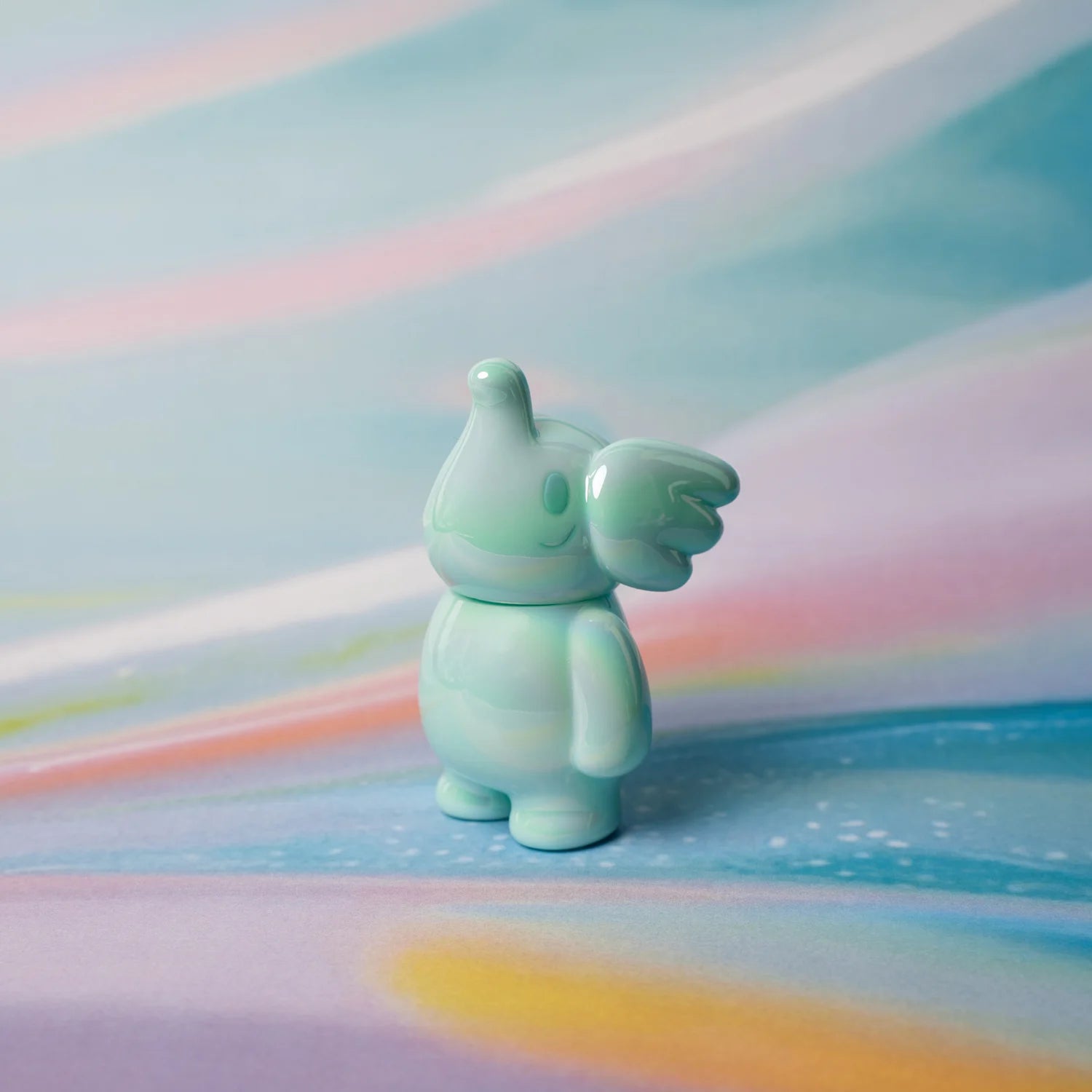 Elfie Here I Am! 100% Tiffany Blue Edition by Too Natthapong, a 3 soft vinyl toy, displayed on a colorful surface.