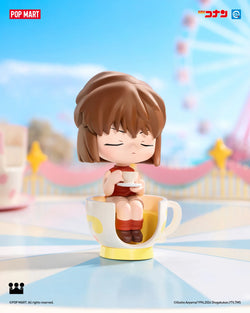 Detective Conan Carnival Blind Box Series: a cartoon figurine of a girl sitting in a teacup, part of a toy collection.