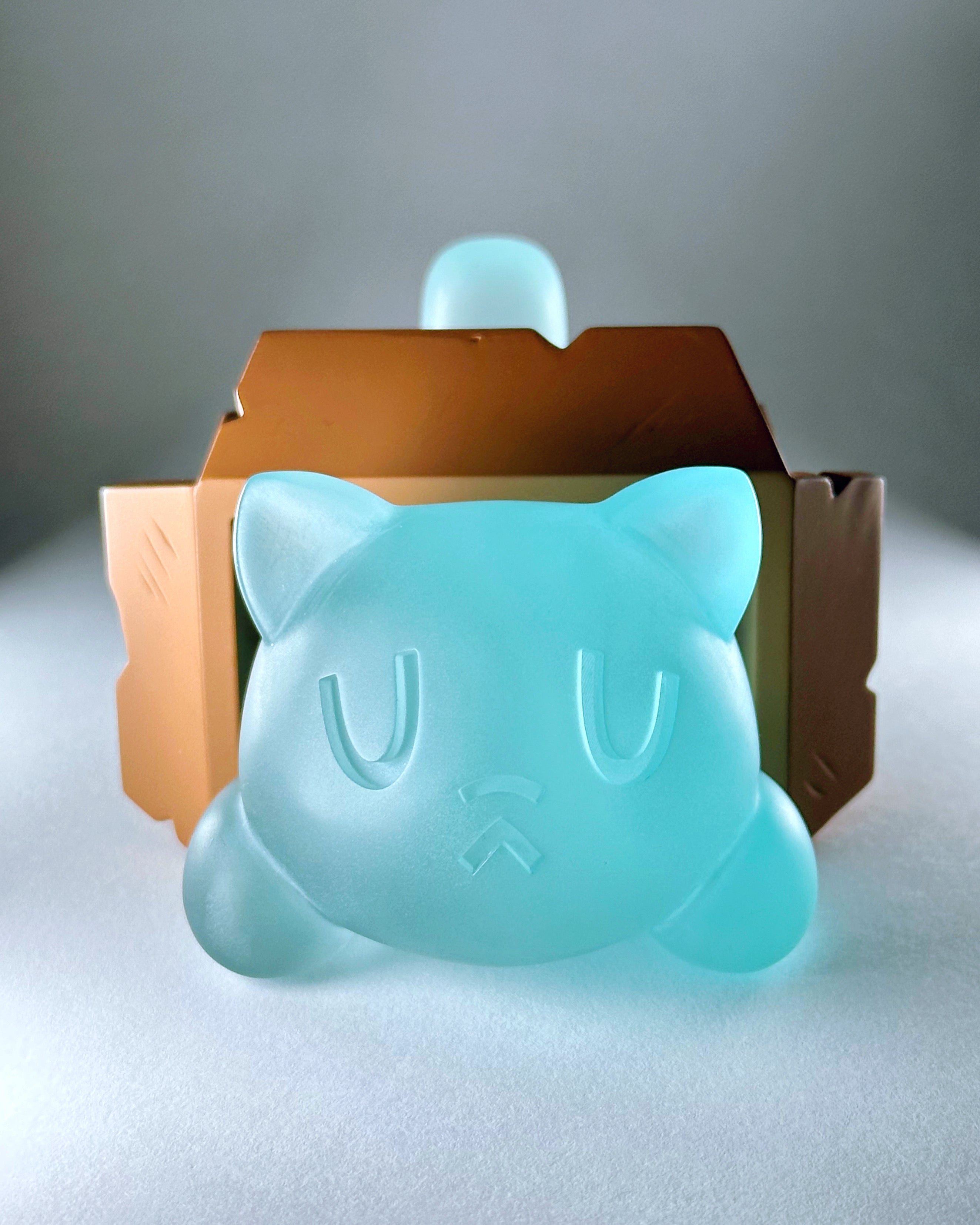 Little Mort by Saint Monday: A blue cat-shaped resin toy with detachable parts and magnets, measuring 5” long, 4” wide, 2.5” tall. Preorder for June 2025.