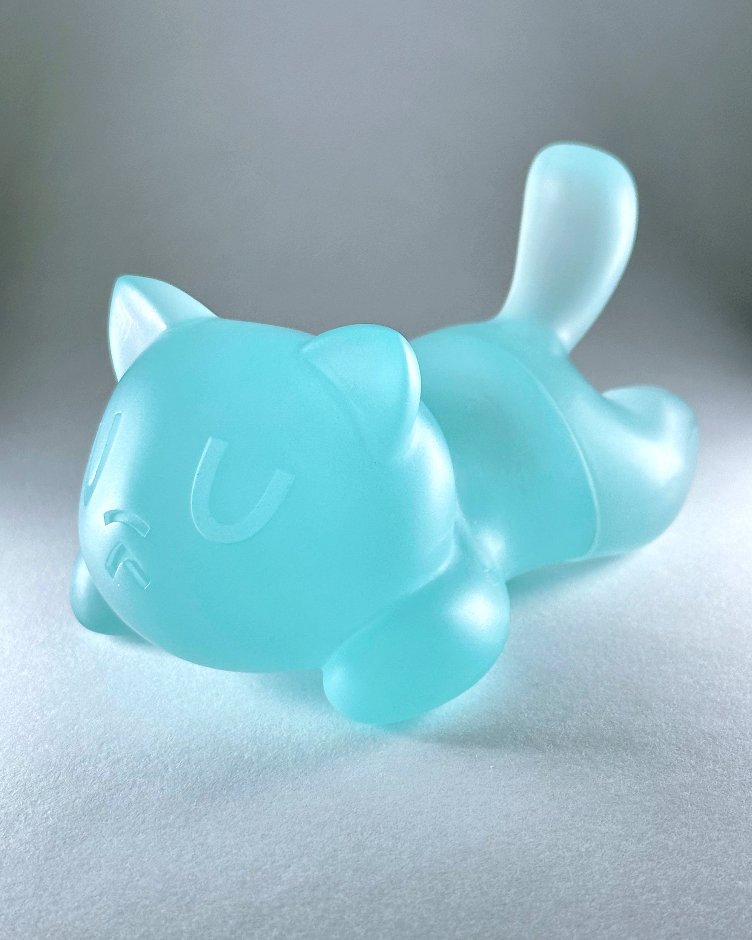 Little Mort by Saint Monday, a 5 resin GID cat toy with magnetic parts, suitable for preorder, displayed on a white surface.