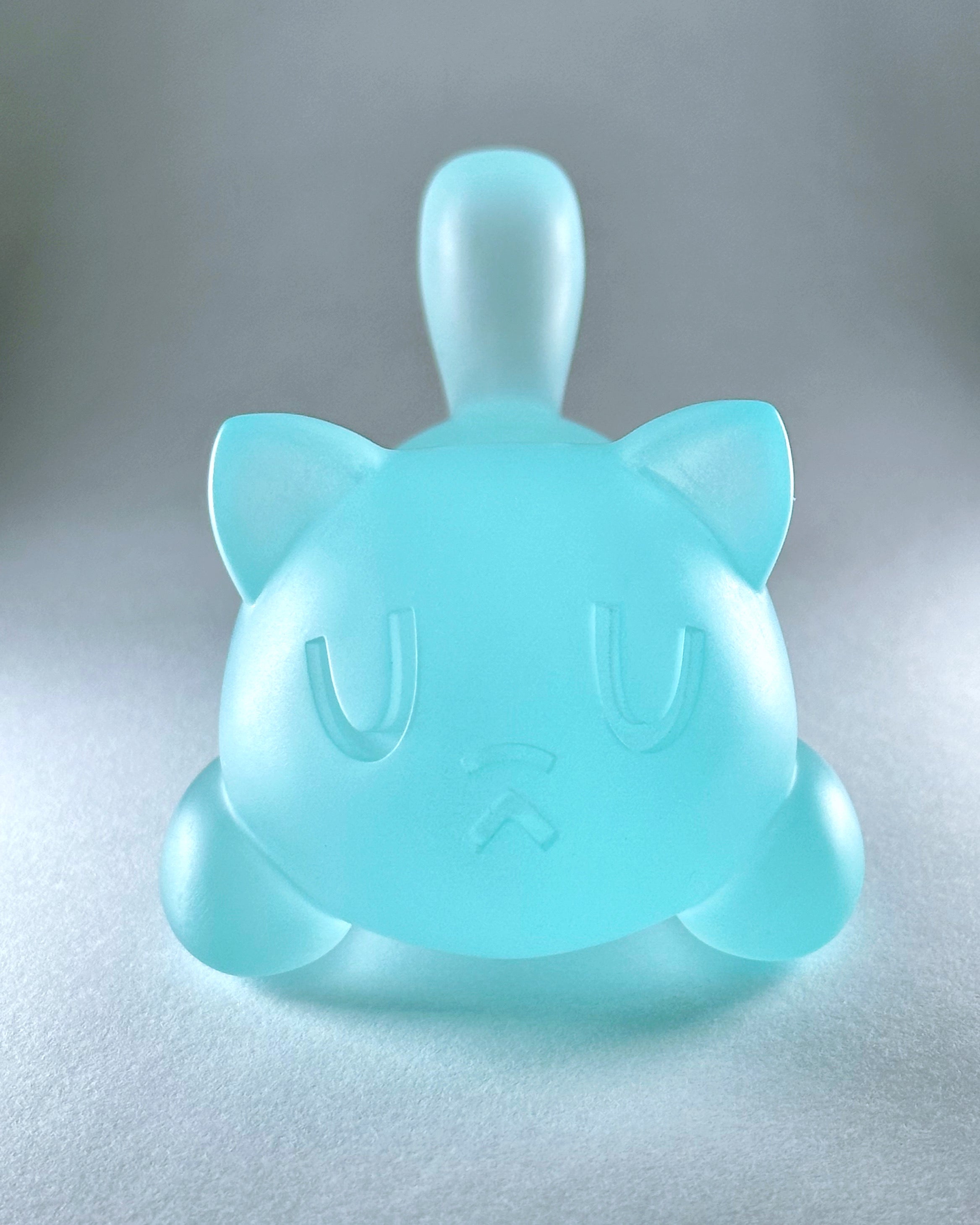 Little Mort by Saint Monday, a 5-inch resin cat-shaped toy with magnets, designed as a piggy bank. Preorder available, ships June 2025.