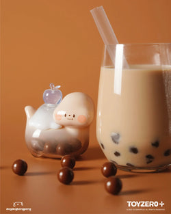 Foodie Dinosaur - Fujiyama Bubble Tea - Preorder, a glass of milk with a straw and a toy animal, a small figurine of a dog, and a close-up of a straw.