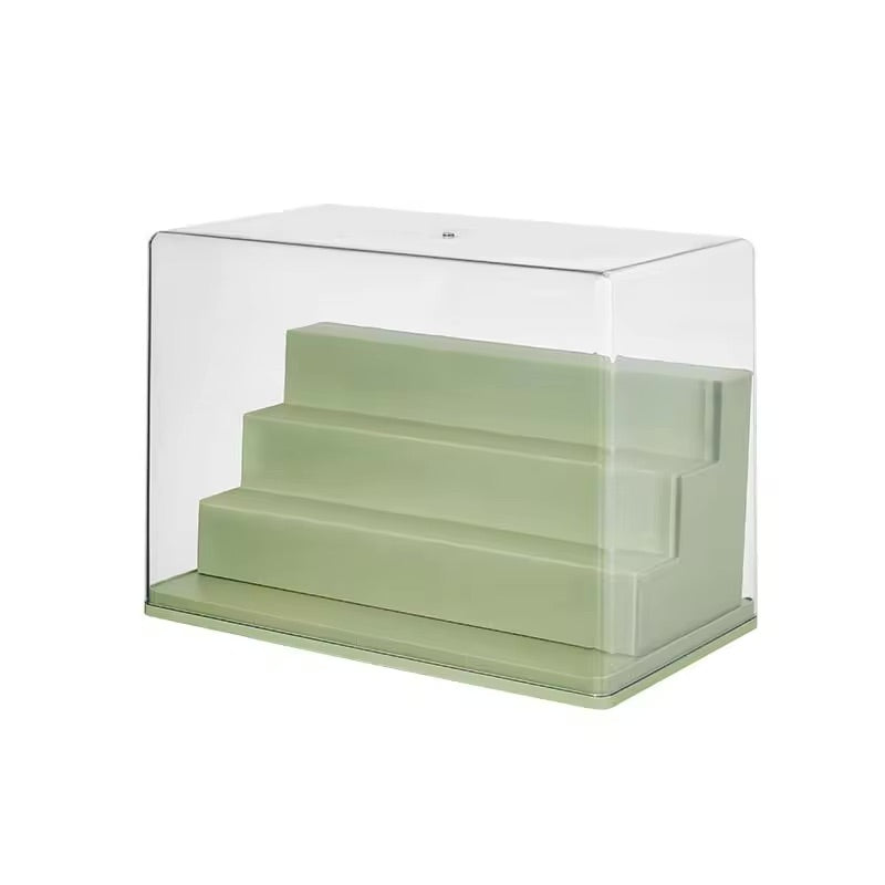 A stackable Mini Figure Display Case in green plastic with clear steps. Preorder - Ships July 2024. Available in Medium: 30*17*23.5cm, Large: 34*23*31.5cm.