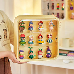 A person holding a toy display case with various figurines, suitable for wall mounting or table display.