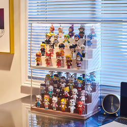 Alt text: Mini Figure Display Case showcasing various toy figurines on a shelf, including cartoon characters and dolls. Preorder - Ships July 2024. Stackable design in two sizes: Medium 30*17*23.5cm, Large 34*23*31.5cm. From Strangecat Toys.