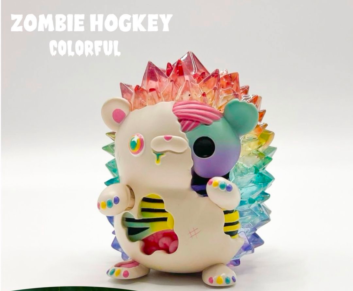 Zombie Hogkey - Rainbow Ver. by Tangent. An 8 cm tall, resin toy hedgehog with a colorful face. Preorder for August 2024.