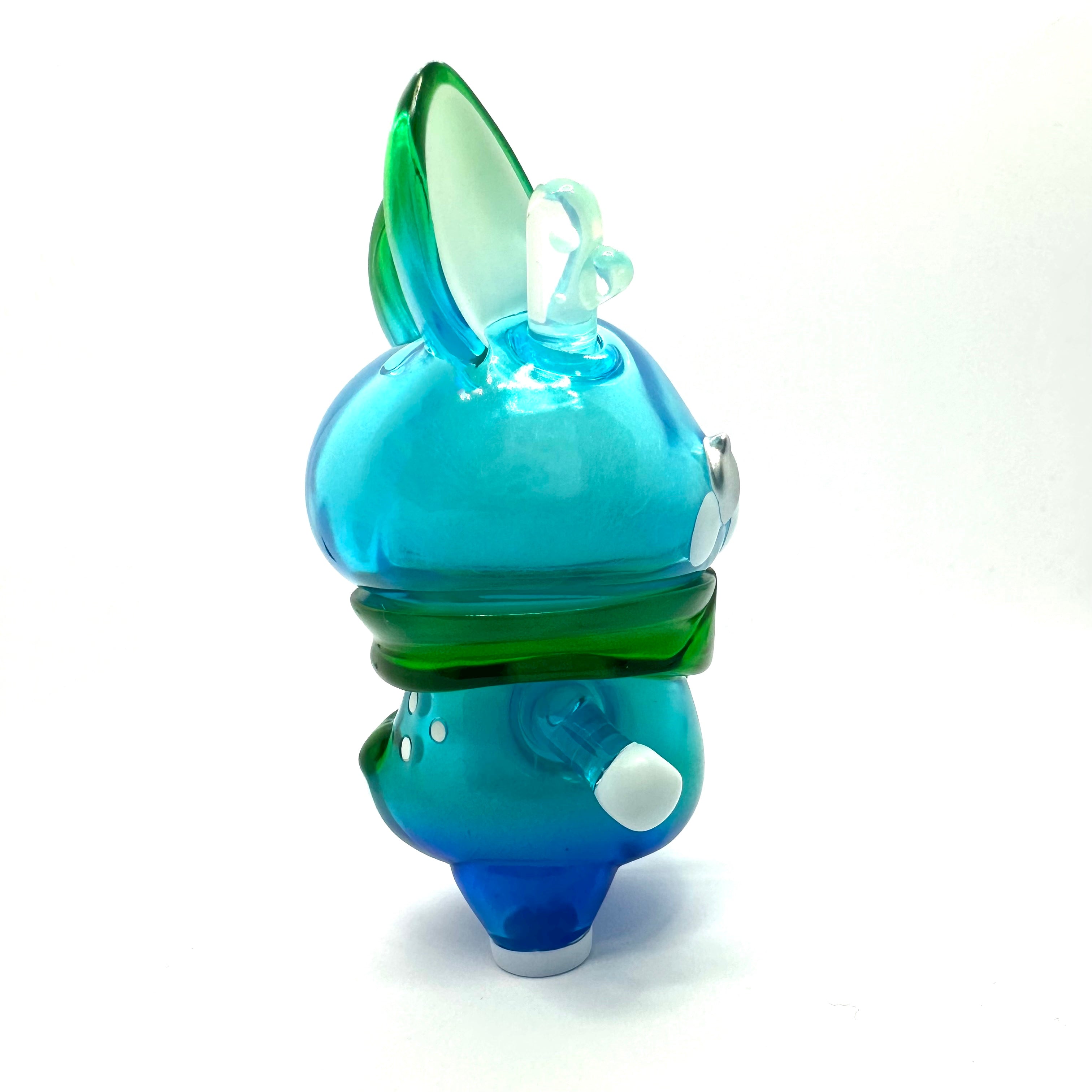 A whimsical glass sculpture of Momiji-chan Blue Pond by Asako Hashi, a unique character inspired by a deer on a playful journey through Hokkaido.