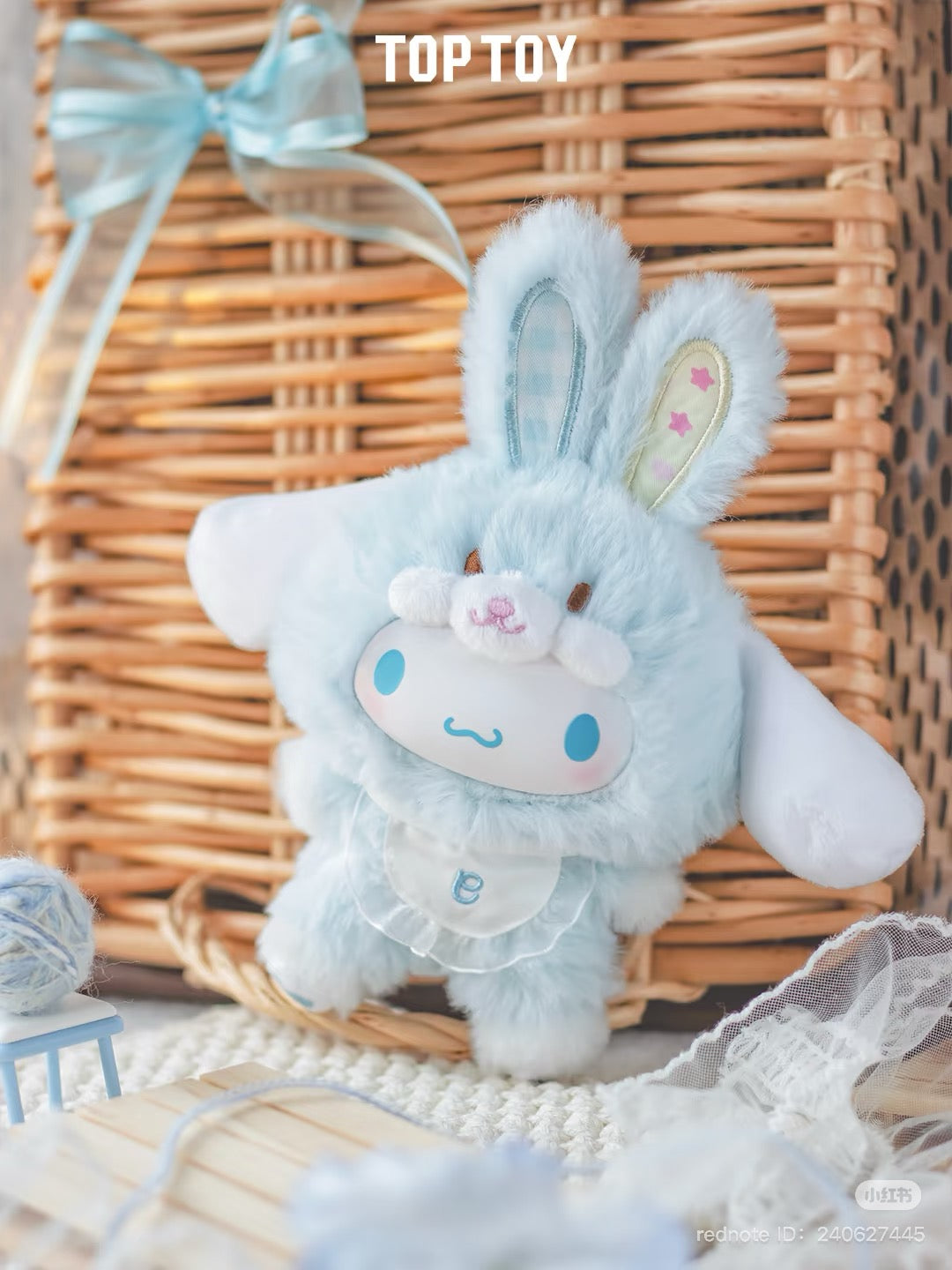 Sanrio Elf Bunny Baby Plush Keychain Blind Box Series toy, featuring a blue bunny plush next to a wicker basket. Preorder available for March 2025.