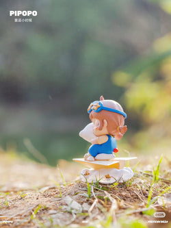 PIPOPO Return to Childhood Series Blind Box features a toy figurine of a girl on a skateboard, part of a collectible set.