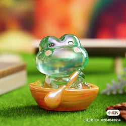 A small glass frog figurine from the Autumn hidden by the frog little MI Blind Box Series by Strangecat Toys. Includes 6 regular designs and 8 secrets.