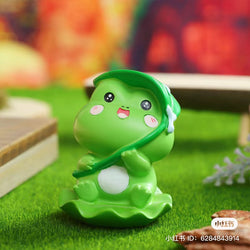A blind box toy series featuring Autumn hidden by a frog figurine. Explore 6 regular designs and 8 secrets. Available at Strangecat Toys.