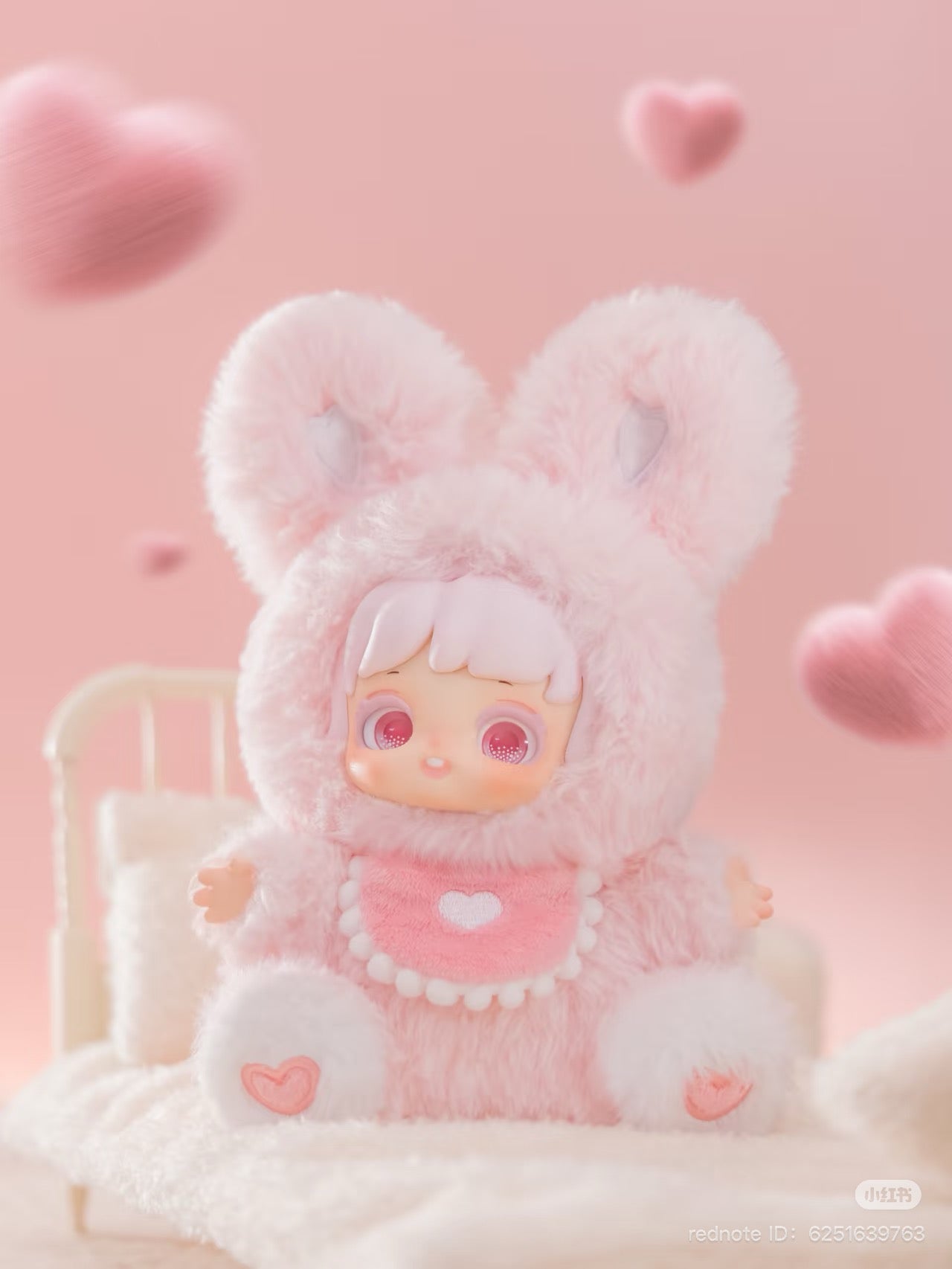 Nighty-Night To U Plush Keychain Blind Box featuring a pink stuffed animal in a bunny garment, highlighting its plush material and playful design.