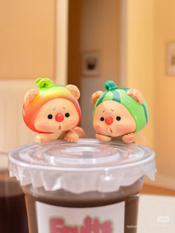 OYO Fruit Party HIPPER Blind Box Series toys, featuring two small plastic figures on a container, part of a collectible set with adhesive.