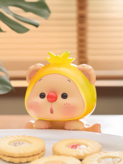 OYO Fruit Party HIPPER Blind Box Series toy on a plate, part of a 12-design collection with adhesive for phone attachment.